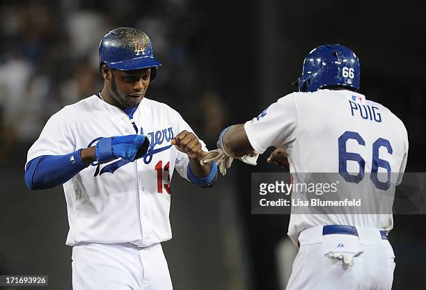 Hanley Ramirez celebrates with teammate Yasiel Puig of the Los Angeles Dodgers in the seventh inning against the Philadelphia Phillies at Dodger...