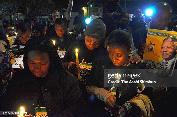 Supporters gather in Vilakazi Street next to former South African President Nelson Mandela's former home in Soweto township on June 27, 2013 in...