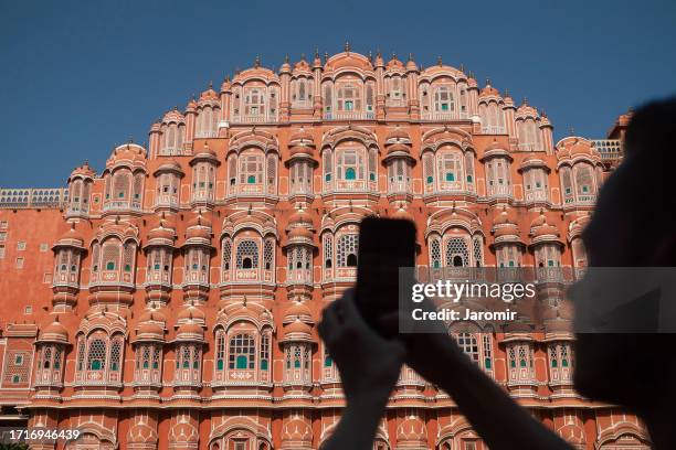 tourist photographing palace hawa mahal in jaipur - vlogging stock pictures, royalty-free photos & images