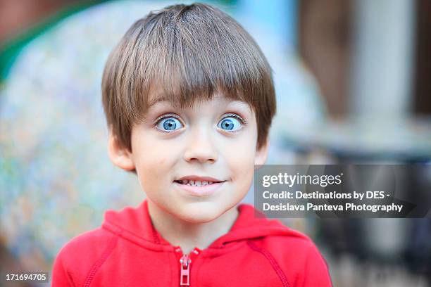 child making faces - clenching teeth stock-fotos und bilder