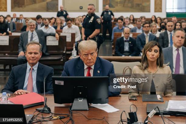 Former U.S. President Donald Trump appears in the courtroom with his attorneys Christopher M. Kise and Alina Habba for the third day of his civil...