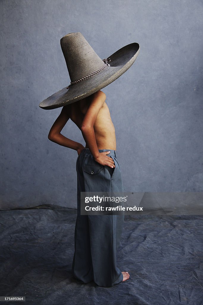 A boy wearing a sombrero