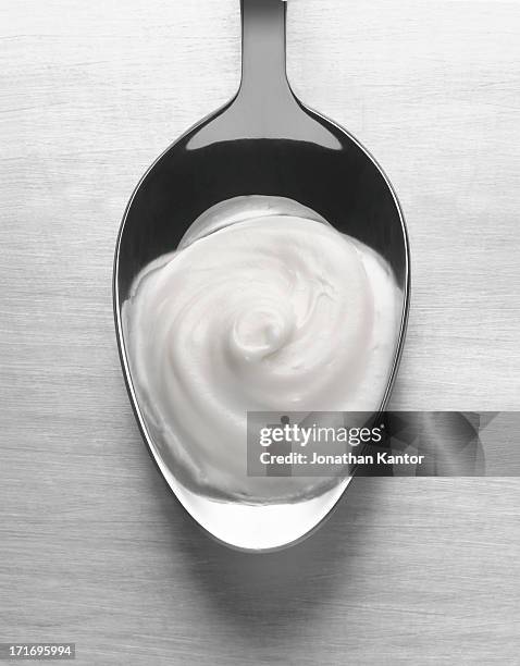 spoonful of yogurt - yogurt spoon stock-fotos und bilder