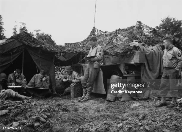 Camouflaged communications command post of the American 2nd Armored Division, V Corps United States Army direct fire for a battery of Armoured Field...