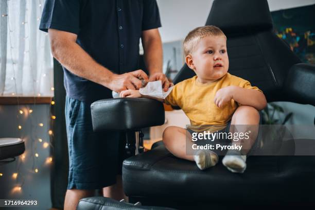 dad puts boy a temporary tattoos - interim stock pictures, royalty-free photos & images