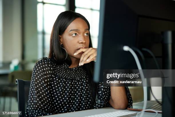 contemplative office worker staring at desktop pc monitor - staring at screen stock pictures, royalty-free photos & images