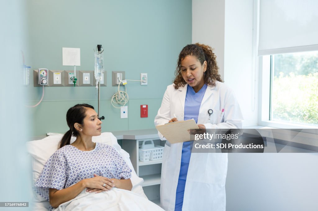 Femal Pacient Female Patient Listens Eagerly To Female Doctor High-Res Stock Photo ...