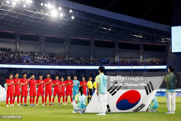 Players of South Korea line up for team photo during the 19th Asian Game Men's Semifinal between South Korea and Uzbekistan at Huanglong Sports...