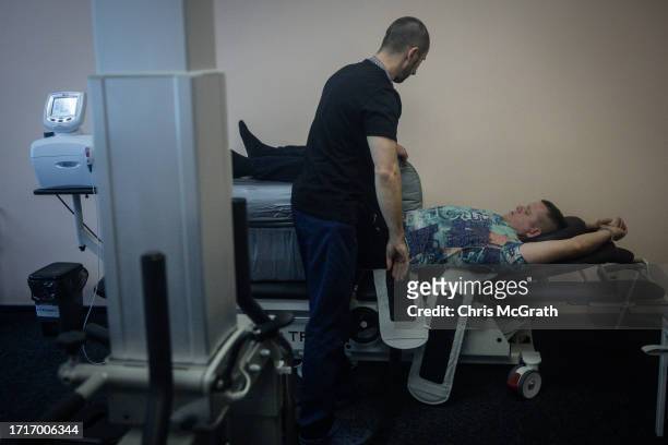 Soldier goes through a spine decompression session at a rehabilitation center for soldiers suffering from injuries and psychological trauma on...