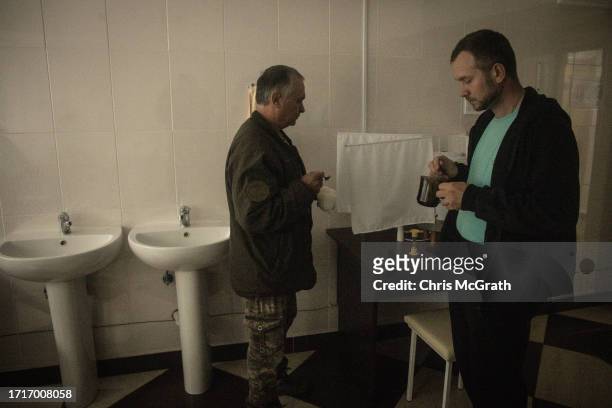 Soldiers take a specially made drink during an oxygen therapy session at a rehabilitation center for soldiers suffering from injuries and...