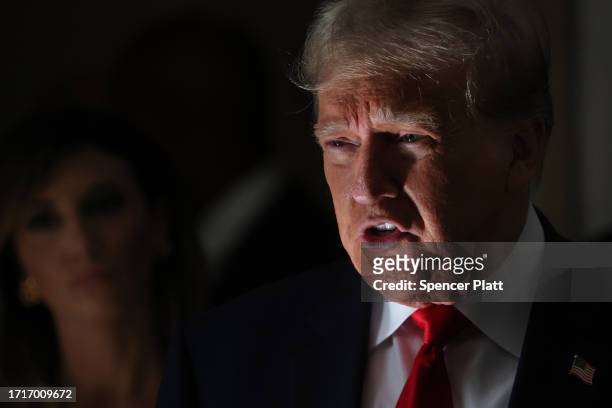 Former U.S. President Donald Trump speaks to the media on the third day of his civil fraud trial at New York State Supreme Court on October 04, 2023...
