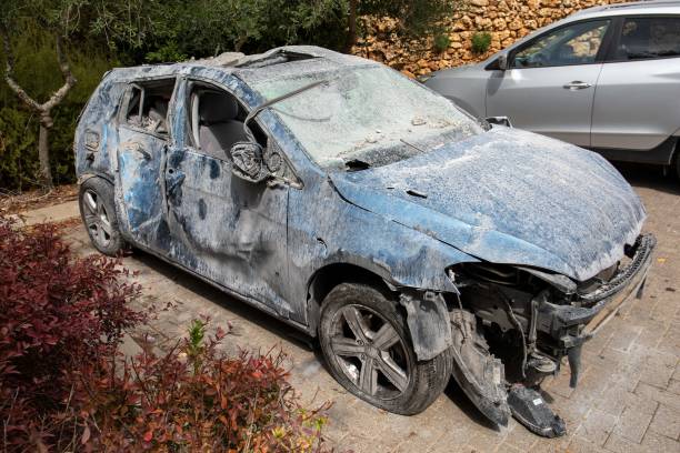 A vehicle damaged as a result of a missile falling yesterday from the Gaza Strip in the village of Har Adar on the outskirts of Jerusalem, October 10, 2023.