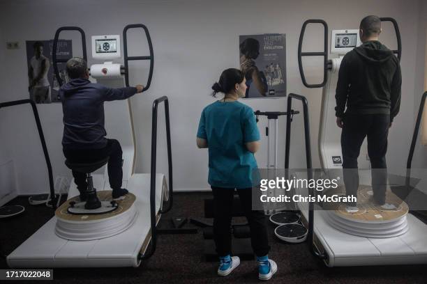 Soldiers use machines to help with balance issues caused by injuries and concussions at a rehabilitation center for soldiers suffering from injuries...