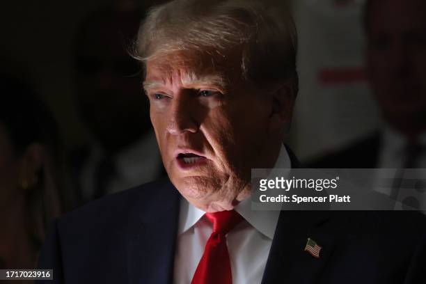 Former U.S. President Donald Trump speaks to the media on the third day of his civil fraud trial at New York State Supreme Court on October 04, 2023...