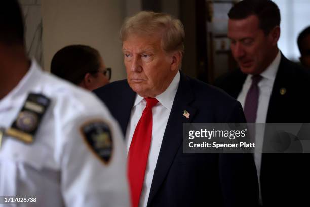 Former U.S. President Donald Trump leaves the courtroom on the third day of his civil fraud trial at New York State Supreme Court on October 04, 2023...