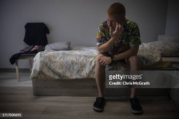 Year old Oleksandr, suffering from phosphorus burns and shrapnel wounds to his foot sustained during fighting in Zaporizhzhia rests on his bed as his...