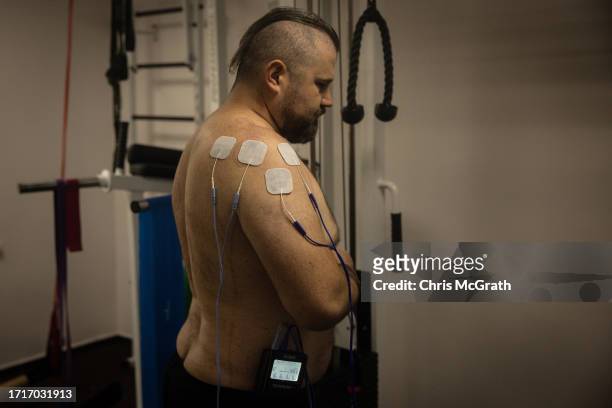 Year-old Andriy, has electrotherapy to stimulate an injury to his arm at a rehabilitation center for soldiers suffering from injuries and...