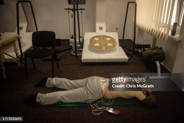Soldier has electrotherapy at a rehabilitation center for soldiers suffering from injuries and psychological trauma on October 04, 2023 in Kyiv,...