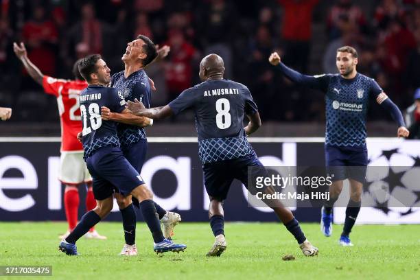 André Castro of SC Braga celebrates with teammates after scoring the team's third goal during the UEFA Champions League match between 1. FC Union...