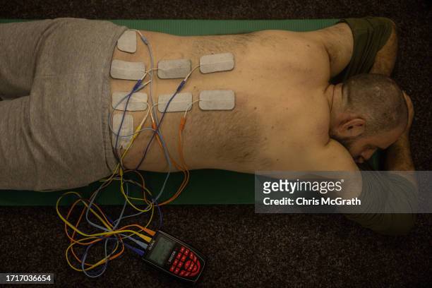 Soldier has electrotherapy at a rehabilitation center for soldiers suffering from injuries and psychological trauma on October 04, 2023 in Kyiv,...