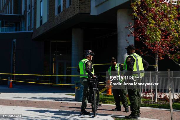 Police officers walk past the Thurgood Marshall Hall at Morgan State University on October 04, 2023 in Baltimore, Maryland. Police are still looking...