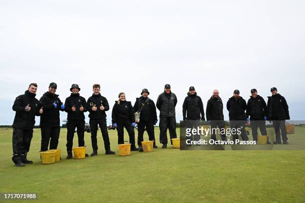 Grounds Staff pose for a photo as they tend to the course following a practice round prior to the Alfred Dunhill Links Championship at the Old Course...