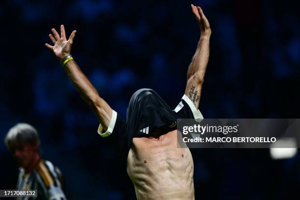 Juventus' former Italian player Fabrizio Ravanelli celebrates a goal during a football match in the "Together, a Black & White Show" event, the first...