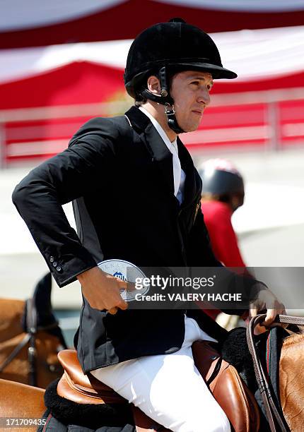 French actor and director Guillaume Canet reacts on June 28, 2013 after taking the second place in the 2013 Monaco International Jumping, part of the...