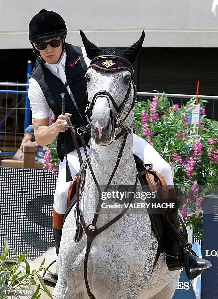 French actor and director Guillaume Canet competes on June 28, 2013 in the 2013 Monaco International Jumping, part of Global Champions Tour. AFP...