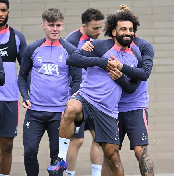 Kostas Tsimikas of Liverpool with Mohamed Salah of Liverpool at AXA Training Centre on October 04, 2023 in Kirkby, England.