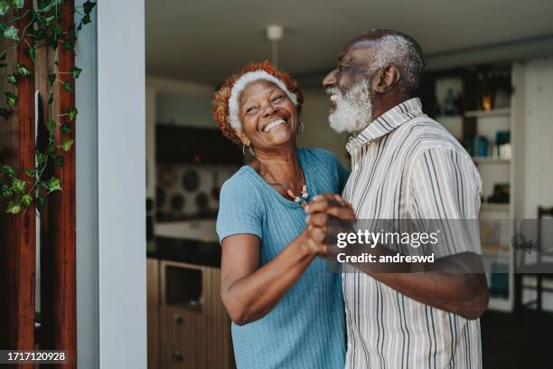 portrait senior couple dancing together - senior women laughing stock pictures, royalty-free photos & images