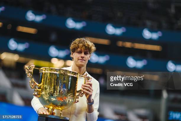 Winner Jannik Sinner of Italy poses with the Champion Trophy during the awards ceremony following the Men's Singles Final match against Daniil...