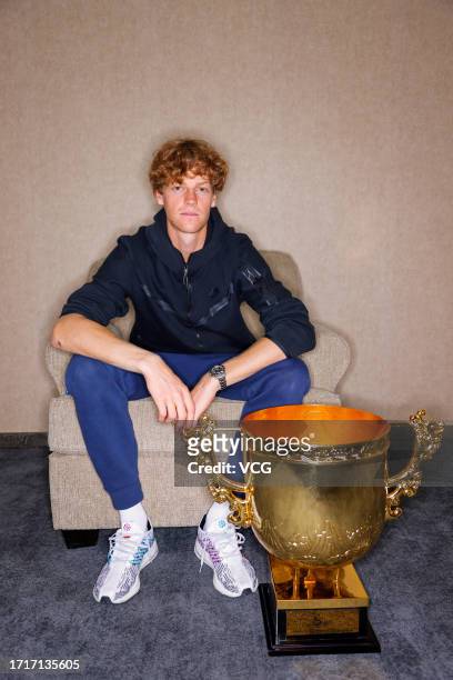 Winner Jannik Sinner of Italy poses with the Champion Trophy during a photocall after the Men's Singles Final match against Daniil Medvedev of Russia...