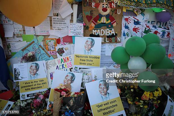 Tributes in honour of Nelson Mandela continue to grow outside the Mediclinic Heart Hospital where he is being treated on June 28, 2013 in Pretoria,...