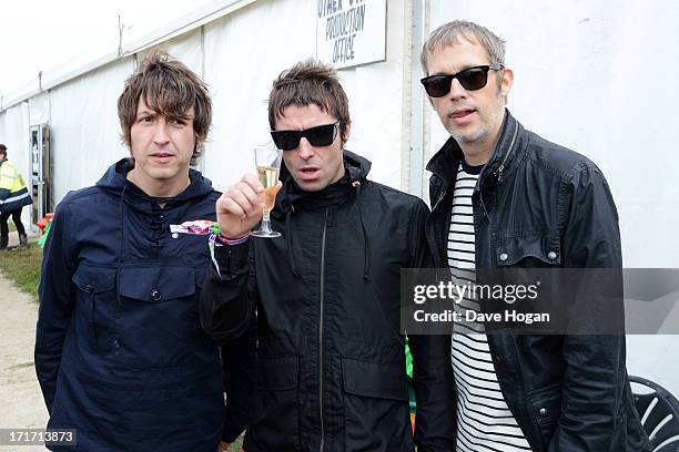 Gem Archer, Liam Gallagher and Andy Bell of Beady Eye pose backstage at day 2 of the 2013 Glastonbury Festival at Worthy Farm on June 28, 2013 in...