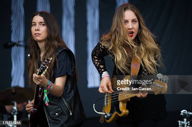 Danielle Haim and Este Haim of 'Haim' perform live on the Pyramid Stage at day 2 of the 2013 Glastonbury Festival at Worthy Farm on June 28, 2013 in...