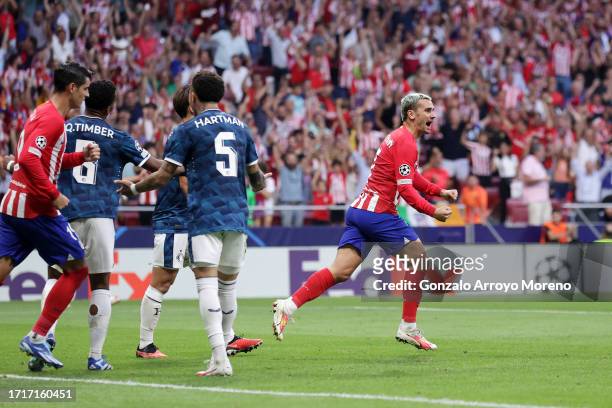 Antoine Griezmann of Atletico Madrid celebrates after scoring the team's second goal to equalise during the UEFA Champions League match between...
