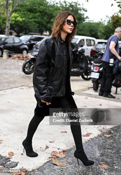Christine Centenera is seen wearing a black leather jacket, black skirt and black sunglasses outside the Chanel show during the Womenswear...