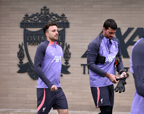 Diogo Jota and Alisson Becker of Liverpool during a training session at AXA Training Centre on October 04, 2023 in Kirkby, England.