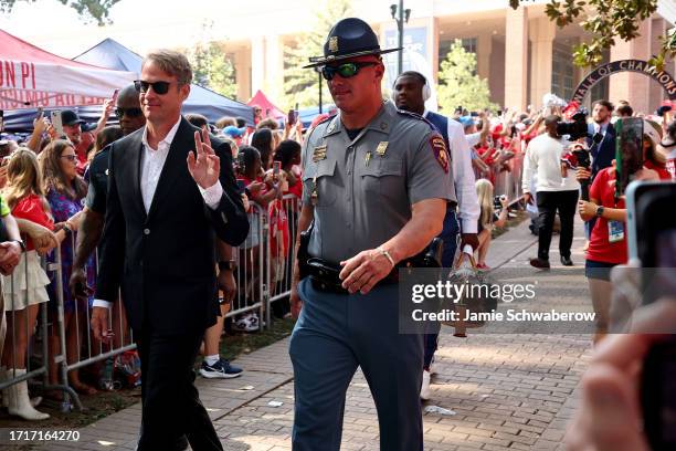Head Coach Lane Kiffin of the Mississippi Rebels walks down the Walk of Champions in the Grove prior to taking on the LSU Tigers at Vaught-Hemingway...