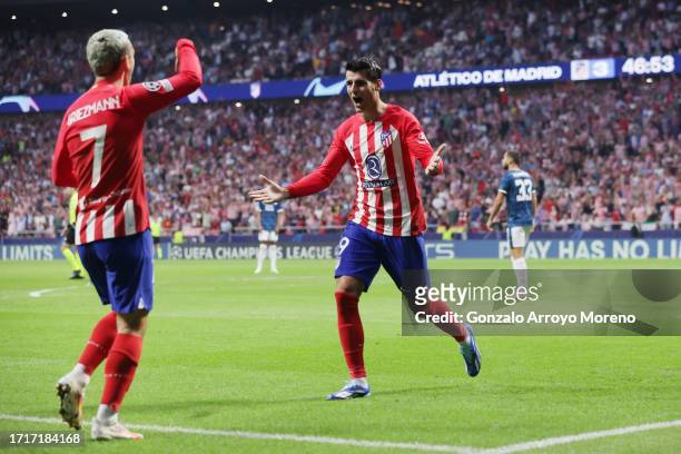 Alvaro Morata of Atletico Madrid celebrates with Antoine Griezmann of Atletico Madrid after scoring the team's third goal during the UEFA Champions...