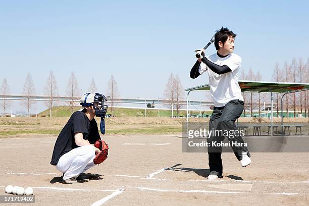asian men playing baseball - at bat ストックフォトと画像