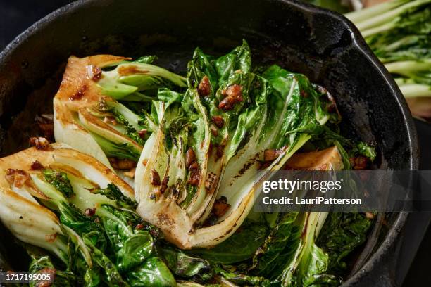 garlic and soy roasted baby bok choy - stirfry stock pictures, royalty-free photos & images