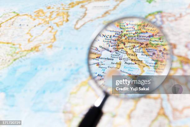 italy and  magnifying glass - europe map stock pictures, royalty-free photos & images