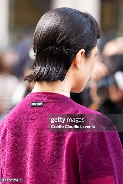 Guest wears a pink Miu Miu top, outside Miu Miu, during the Womenswear Spring/Summer 2024 as part of Paris Fashion Week on October 03, 2023 in Paris,...