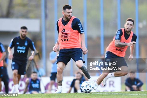 Lionel Messi of Argentina drives the ball during a training session ahead of a Qualifier match against Paraguay at Lionel Messi Training Camp on...