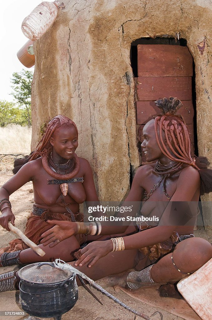 Himba women cooking in Namibia