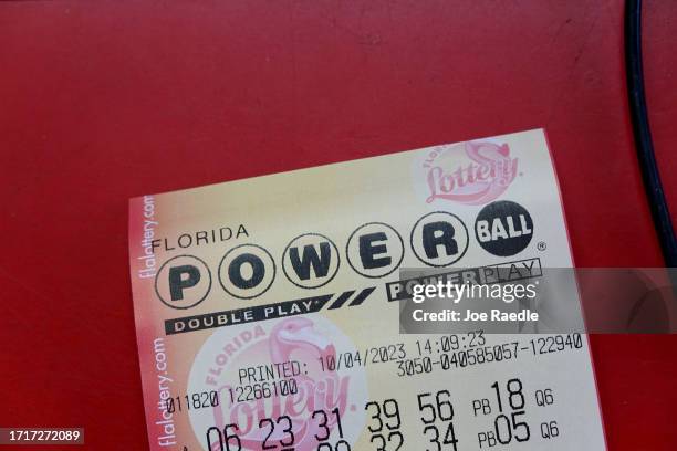 Powerball ticket is seen on a counter after being purchased in a store on October 04, 2023 in Miami, Florida. Wednesday's Powerball drawing will be...