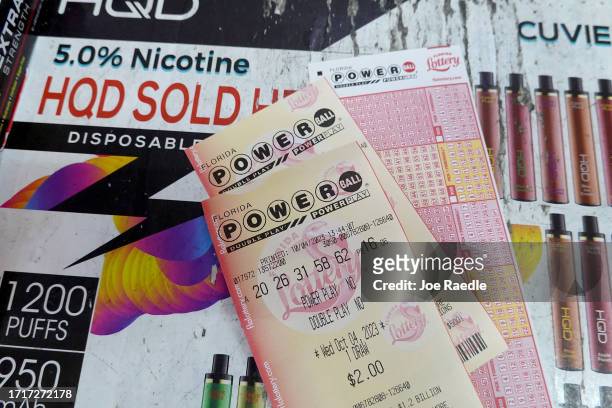 Powerball tickets are seen on a counter after being purchased in a store on October 04, 2023 in Miami, Florida. Wednesday's Powerball drawing will be...
