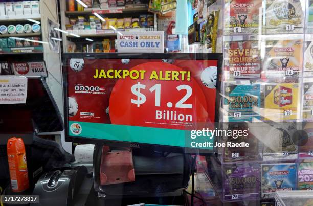 Sign shows the estimated jackpot for Powerball in the window of a store on October 04, 2023 in Miami, Florida. Wednesday's Powerball drawing will be...